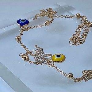 Evil eye filigree elephant charm gold tone  bracelet